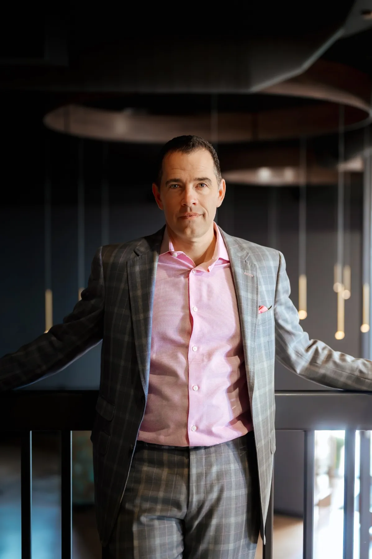 Executive portrait in a plaid suit